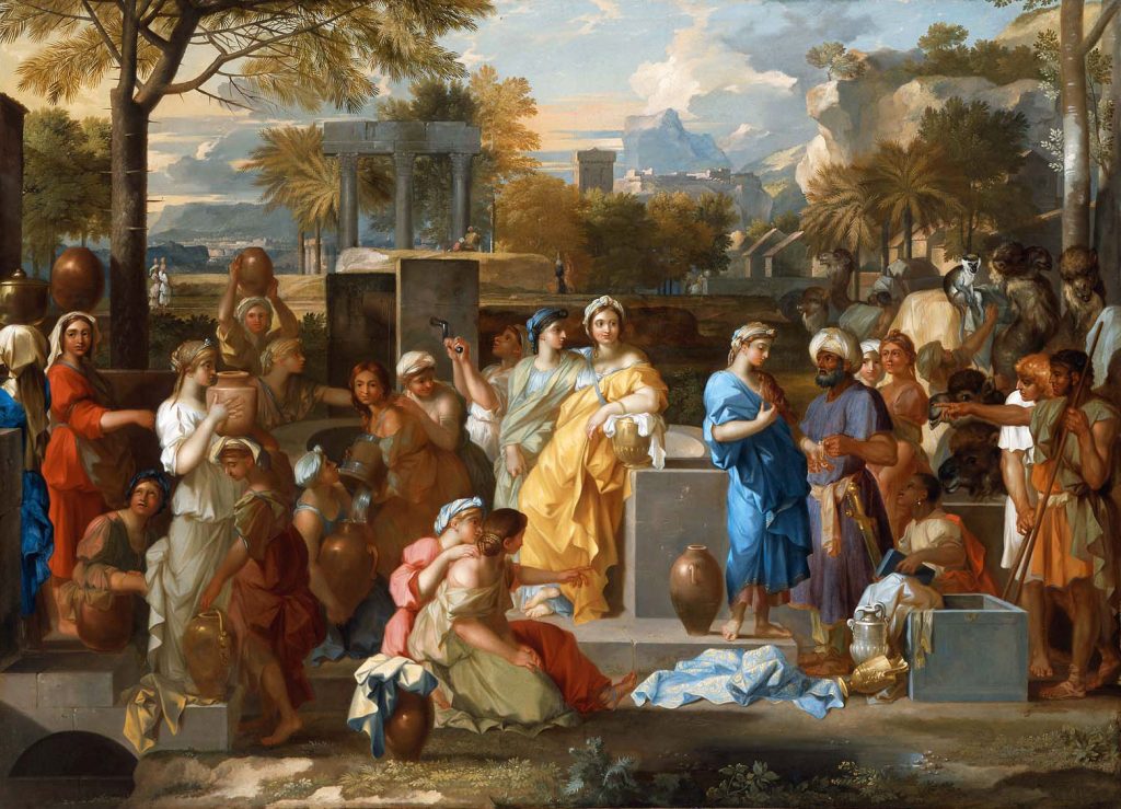 Rebecca et Eliezer au puits entourés d'une foule de villageois dans un décor exotique : costumes en drapés, palmiers, chameaux, petit singe